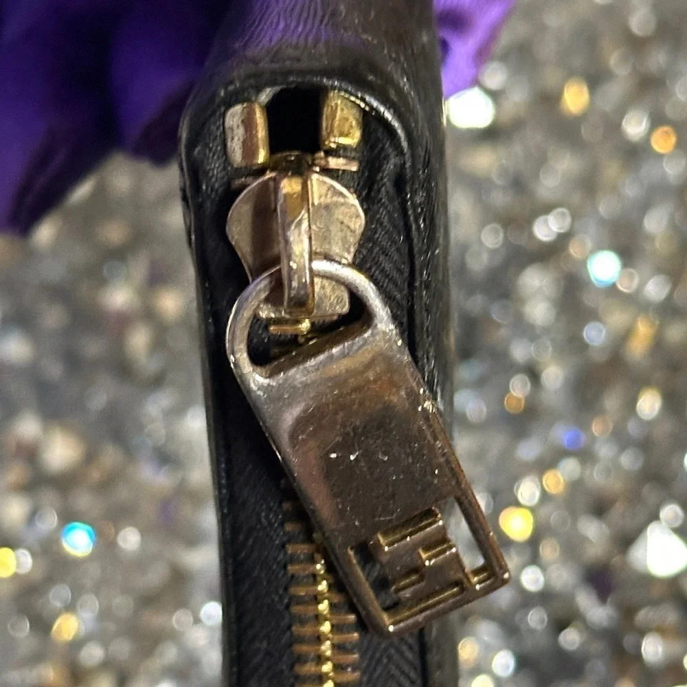 Vintage Fendi black patent leather zip-around continental wallet.